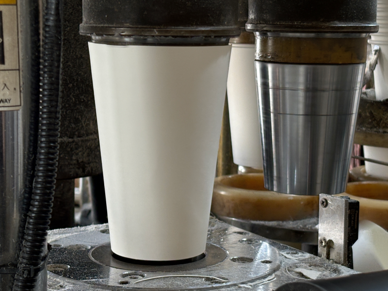 Different factors influencing custom paper cup pricing including materials, printing, packaging, and shipping.